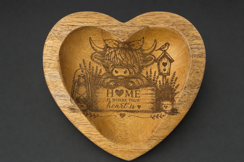 Heart-shaped wooden bowl with laser engraved Highland cow and Home Is Where Your Heart Is verse