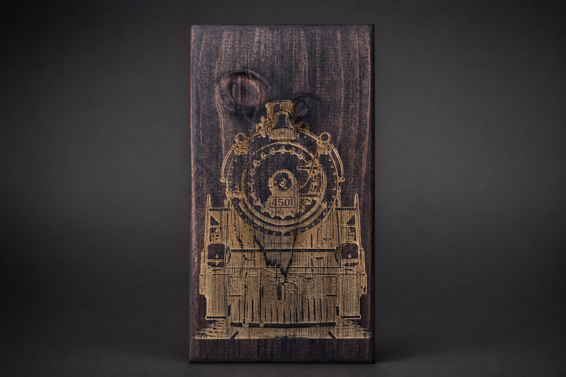 Dark-stained wood plaque with laser engraved steam locomotive number 4501
